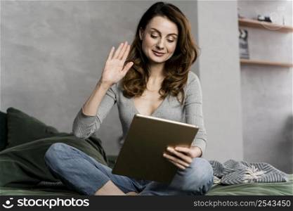 woman bed streaming with tablet