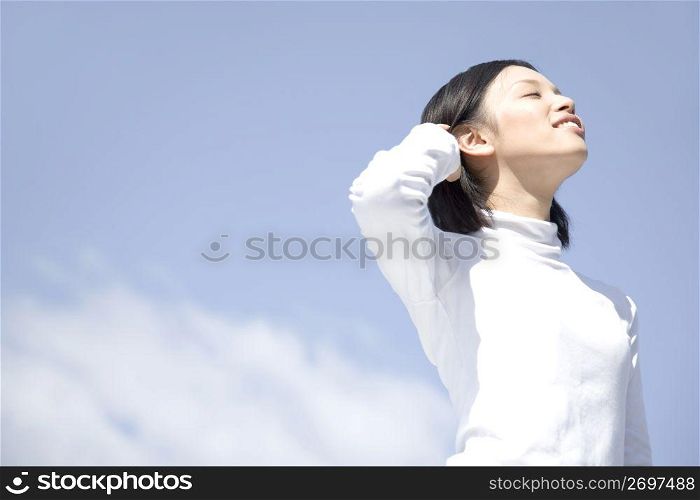 Woman below the blue sky