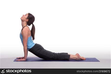 Woman Bending Backward in Yoga Pose on Mat
