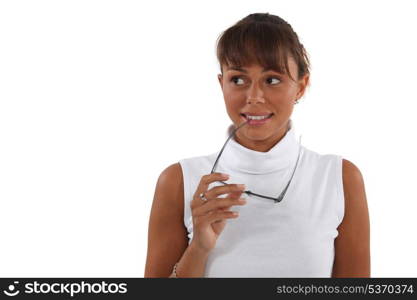 Woman biting glasses