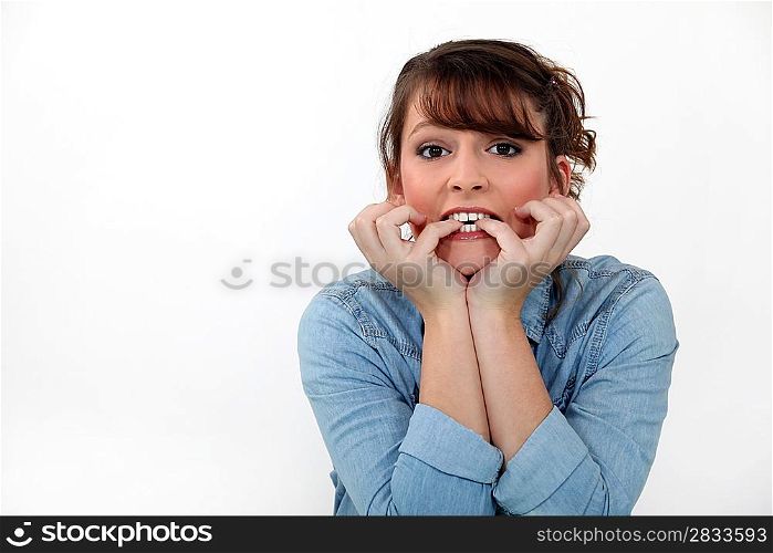 Woman biting her nails.