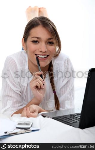 Woman biting pen