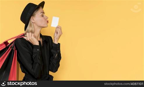 woman black friday sale kissing gesture copy space