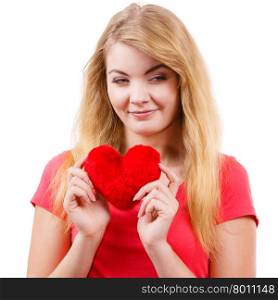 Woman blonde girl holding red heart love symbol . Woman blonde long hair girl holding red heart love symbol studio shot isolated on white. Valentines day happiness concept