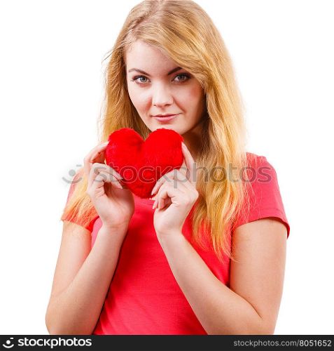 Woman blonde girl holding red heart love symbol . Woman blonde long hair girl holding red heart love symbol studio shot isolated on white. Valentines day happiness concept