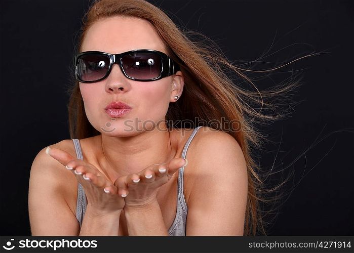 Woman blowing a kiss
