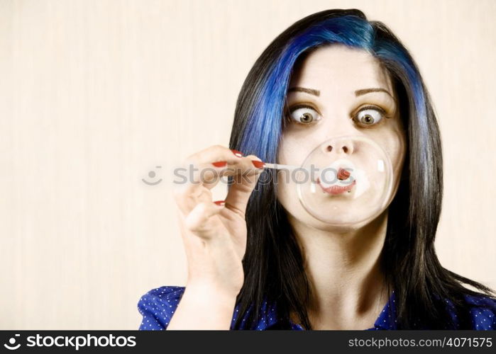 Woman blowing bubbles