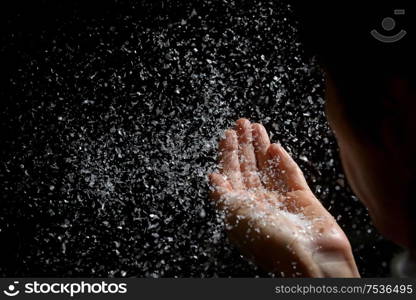 Woman Blowing Fake Snow in The Dark