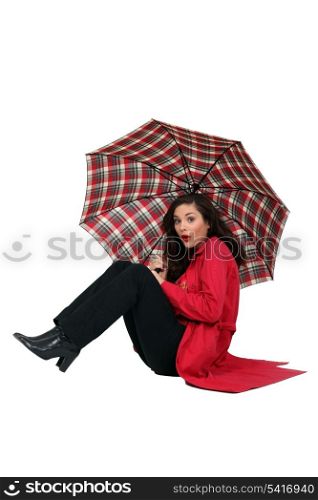 Woman blown over with her umbrella