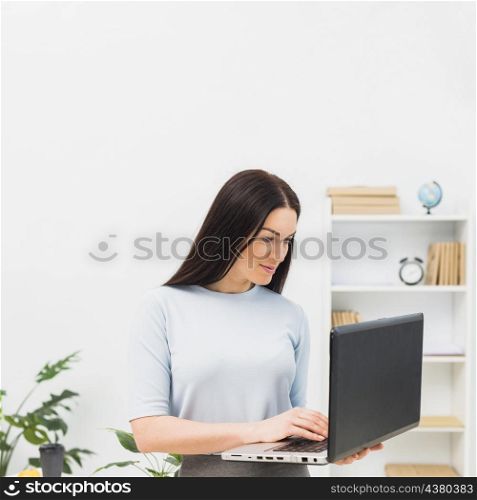 woman blue typing laptop keyboard