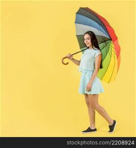 woman blue with rainbow umbrella