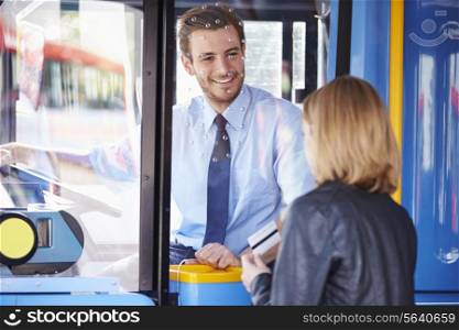 Woman Boarding Bus And Using Pass