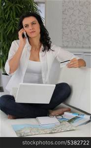 Woman booking a holiday online