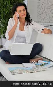 Woman booking her holiday on-line