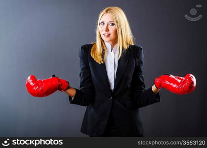 Woman boxer in dark room