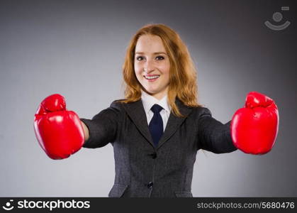 Woman boxer in dark room