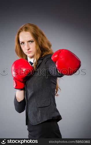 Woman boxer in dark room