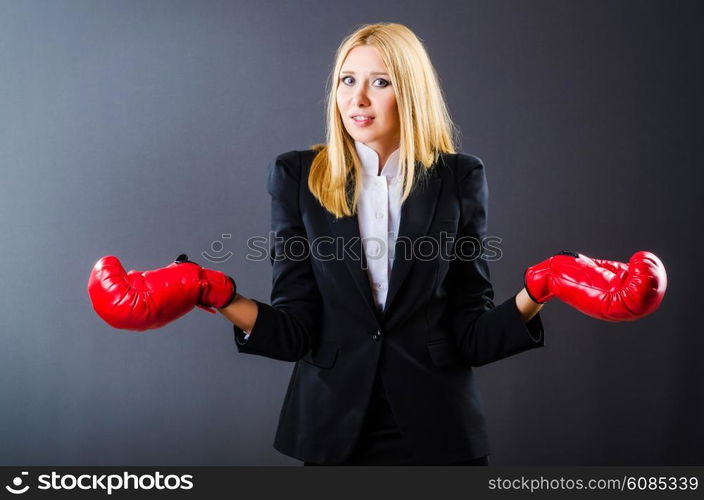 Woman boxer in dark room