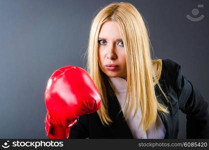 Woman boxer in dark room