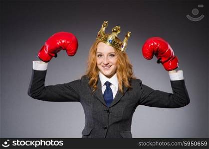 Woman boxer with crown and red gloves