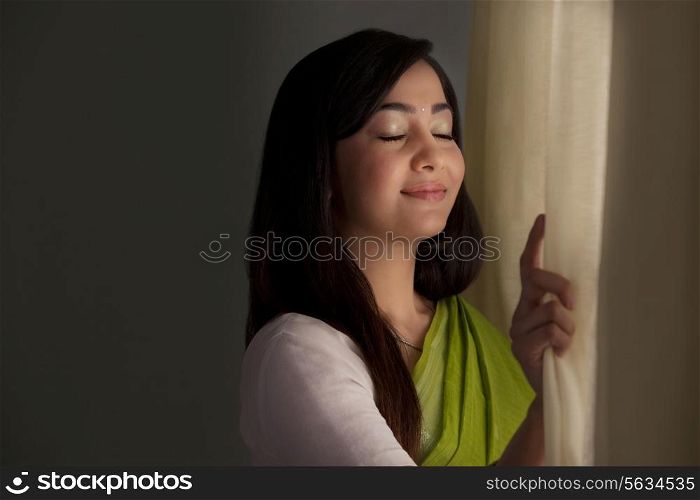 Woman breathing in fresh air