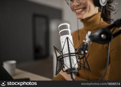 woman broadcasting radio while smiling. Resolution and high quality beautiful photo. woman broadcasting radio while smiling. High quality beautiful photo concept