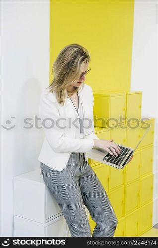 woman browsing laptop colorful background