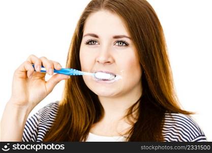 Woman brushing cleaning teeth. Funny girl with toothbrush. Oral hygiene. Isolated on white. Woman brushing cleaning teeth.