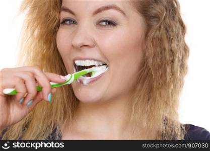 Woman brushing cleaning teeth. Positive girl with toothbrush. Oral hygiene. Isolated on white background. Woman brushing cleaning teeth