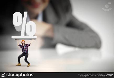 Woman builder. Businesswoman looking at miniature of builder holding percentage sign
