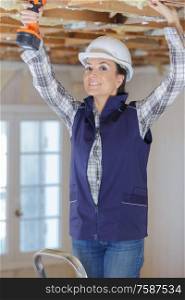woman builder during renovation and insulation
