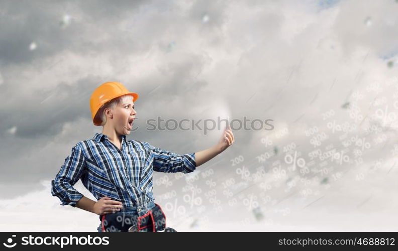 Woman builder in anger. Young emotional woman mechanic screaming in mobile phone