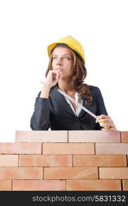 Woman builder measuring isolated on the white