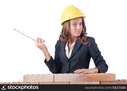 Woman builder measuring isolated on the white