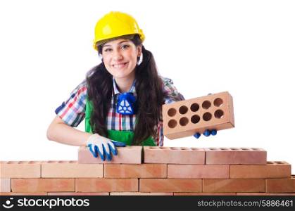 Woman builder with bricks on white