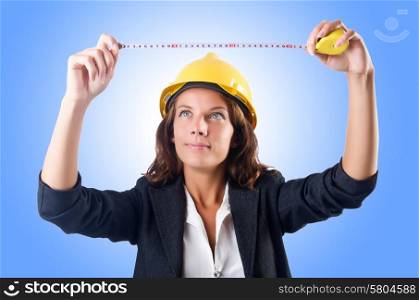Woman builder with measuring tape