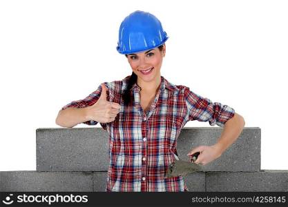 Woman building wall