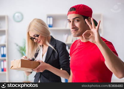 Woman businesswoman receiving mail parcel from courier