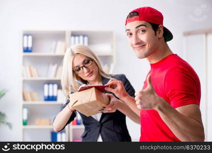 Woman businesswoman receiving mail parcel from courier