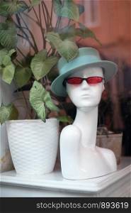 woman bust mannequin with hat and glasses