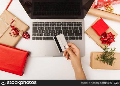 woman buying christmas presents online with gifts table. Resolution and high quality beautiful photo. woman buying christmas presents online with gifts table. High quality and resolution beautiful photo concept