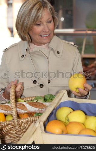 Woman buying fruit