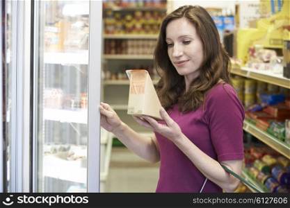 Woman Buying Sandwich From Supermarket