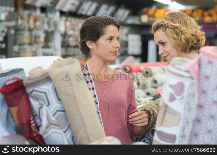 woman buys fabric in a store
