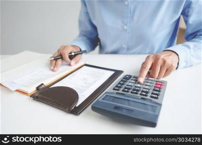 woman calculate number of interest, fee and tax concept