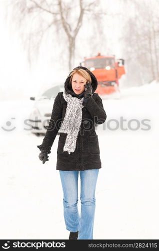 Woman calling for help broken car snow assistance winter road