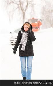 Woman calling for help broken car snow assistance winter road