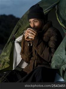 woman camping drinking cup tea