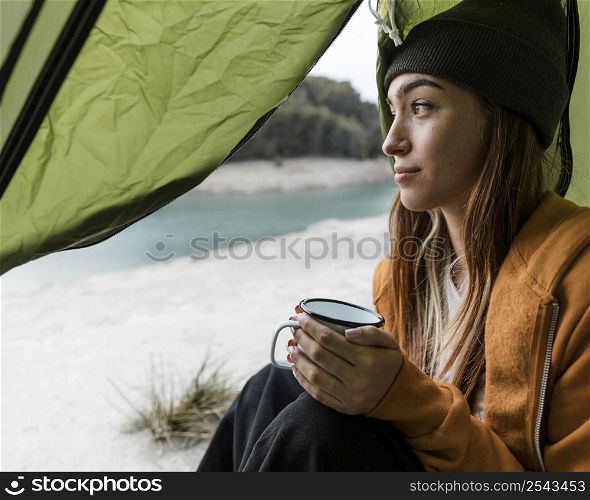 woman camping having cup tea