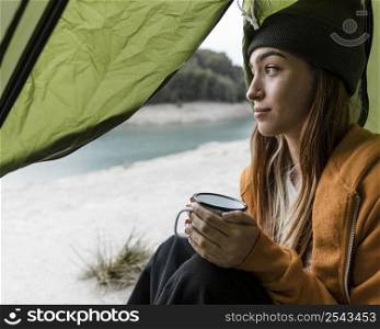woman camping having cup tea
